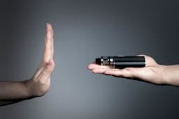 A hand rejecting a vaping device